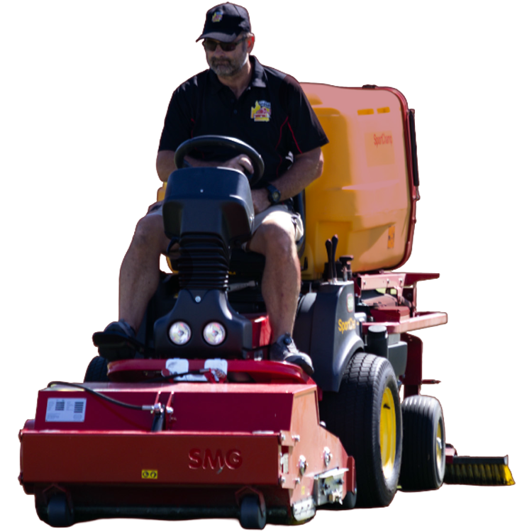 home-hero2 Operator in a cap driving a red SMG turf cleaning machine with a rear brush